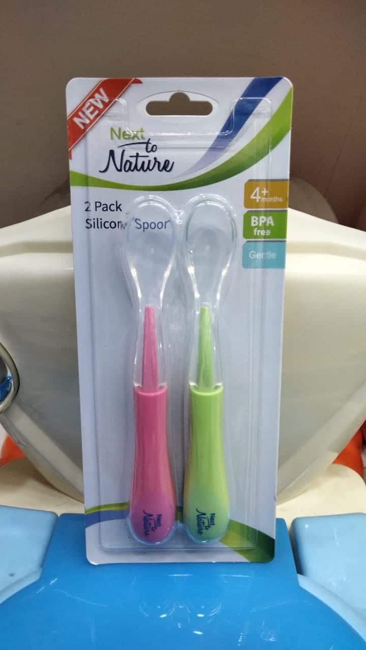 Silicone baby spoon set in pink and green, BPA-free and gentle for infants 4+ months.